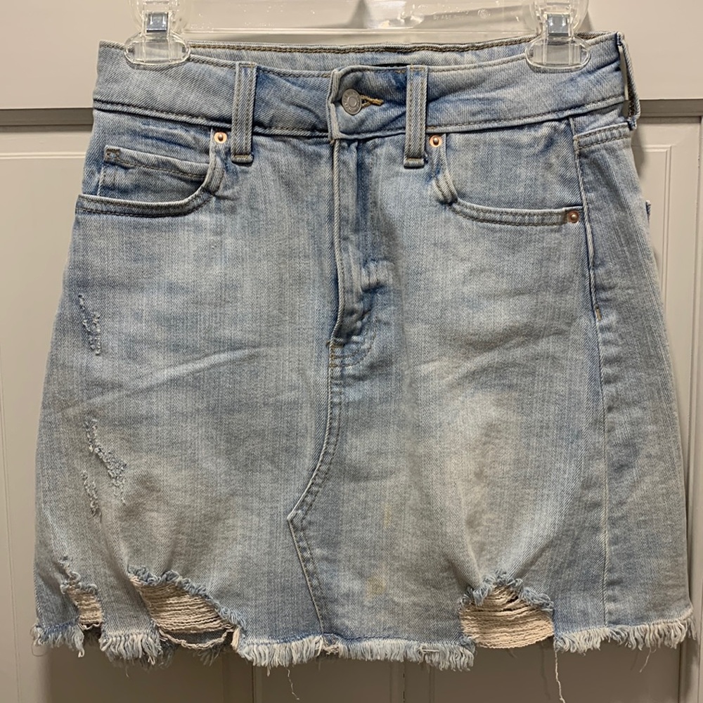 Distressed denim mini skirt